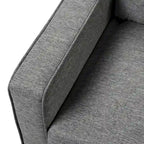 Fauteuil Wystan contemporain à accoudoirs droits avec pieds fuselés en bois massif, fauteuil simple rembourré en tissu par